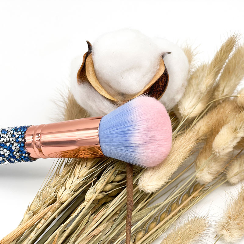 How do you use a buffing brush for foundation application? 
